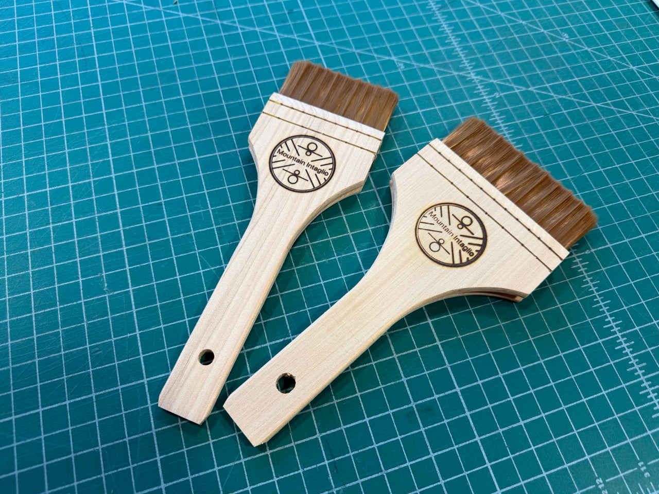 Wood handled synthetic bristle brush