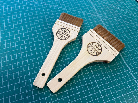 Wood handled synthetic bristle brush